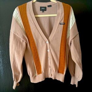 Beautiful Obey Women’s Cardigan. Mauve and neutral colors. 
Obey
Sweater